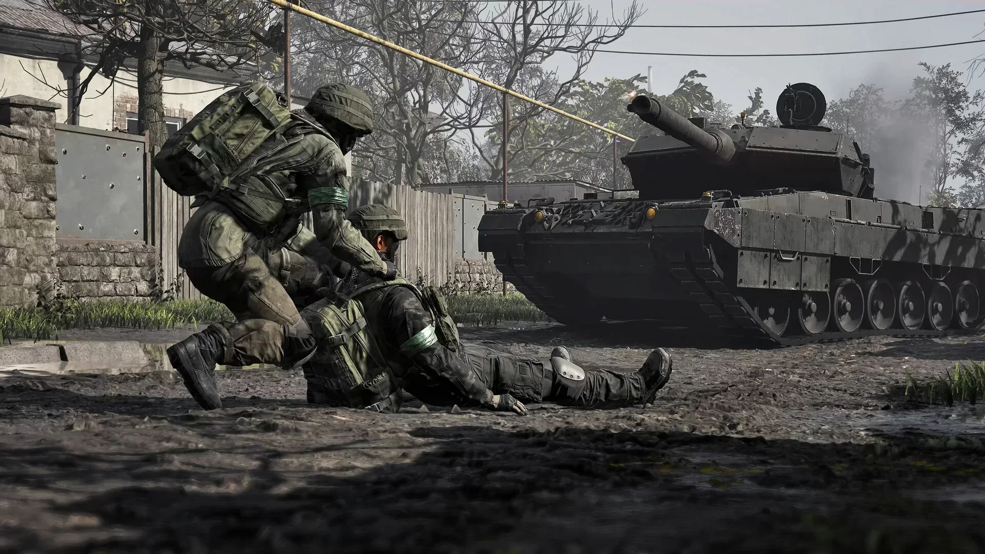 WARDOGS soldiers moving beside a tank in a muddy combat zone
