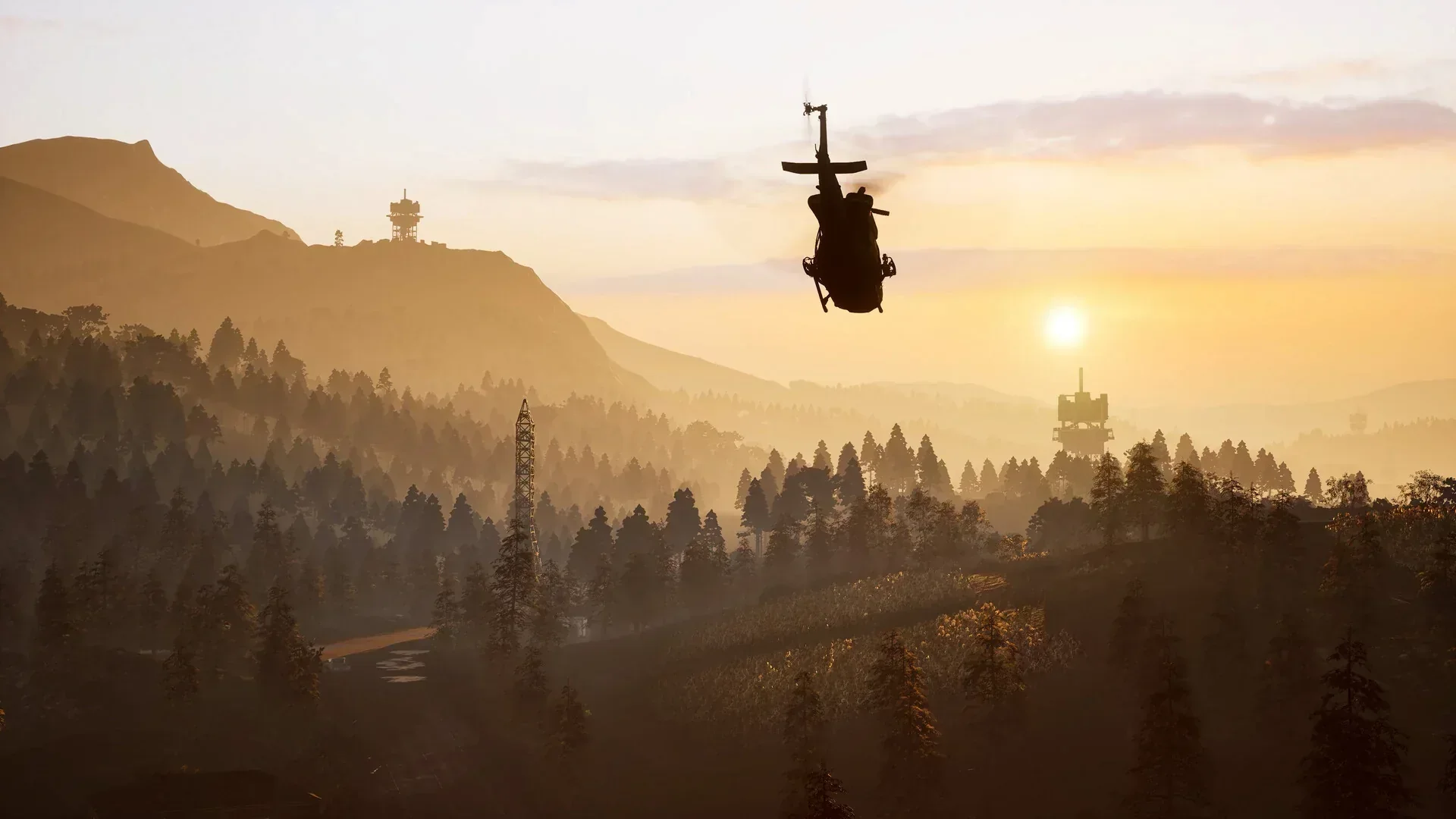 WARDOGS helicopter silhouetted over a sunset mountain valley